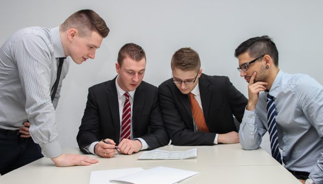Business partners reviewing documents for a UAE shareholder dispute article