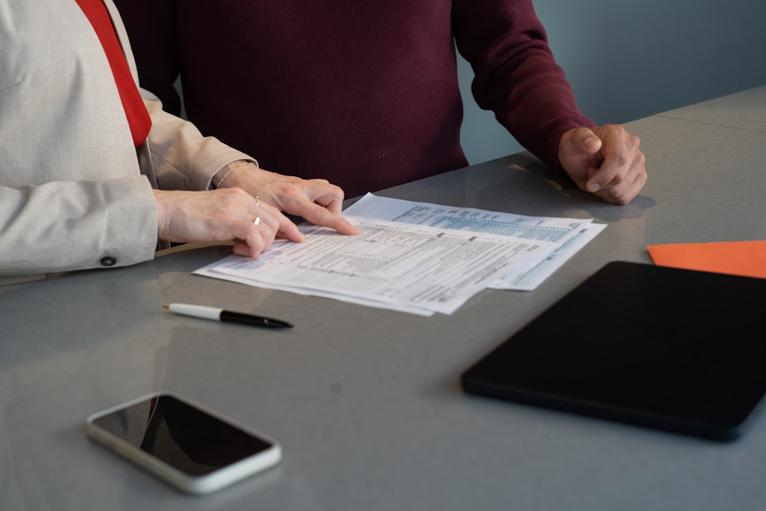Business professionals reviewing commercial contract documents