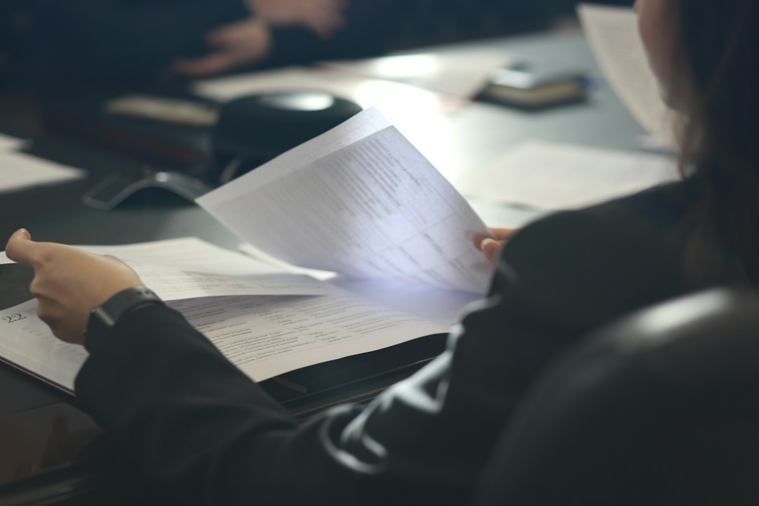 Professional reviewing legal documents for a UAE arbitration clause and enforcement article