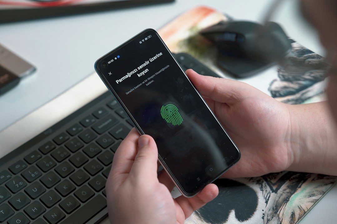 Smartphone fingerprint security illustrating UAE cybercrime social media and digital evidence law